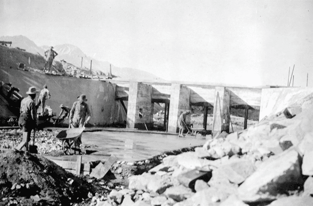 (1912)^*# โ View showing workers constructing the regulating gates at the main canal in Owens Valley.